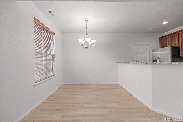 7777 E 23rd Ave Unit 1406, Denver, CO 80238 - unfurnished dining area with a chandelier, light wood-style flooring, baseboards, and recessed lighting