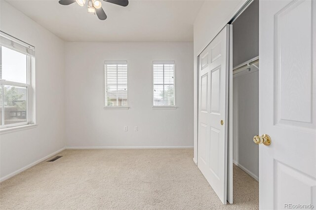 7777 E 23rd Ave Unit 1406, Denver, CO 80238 - unfurnished bedroom with carpet flooring, baseboards, a closet, and a ceiling fan