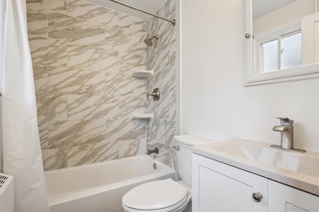 full bathroom featuring vanity, shower / bath combo, and toilet