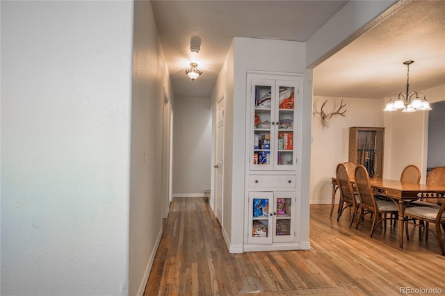 dining room with a chandelier and hardwood / wood-style floors