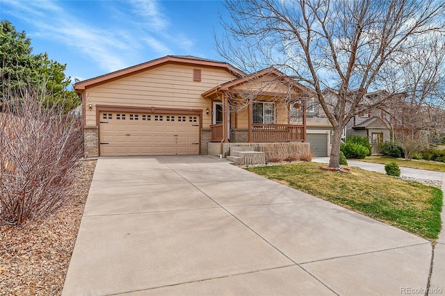 5162 Hubert St, Parker, CO 80134 - ranch-style house featuring brick siding, driveway, a garage, and covered porch