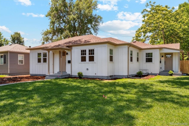 4465 N Umatilla St, Denver, CO 80211 - view of front of house featuring board and batten siding, a front lawn, and a shingled roof