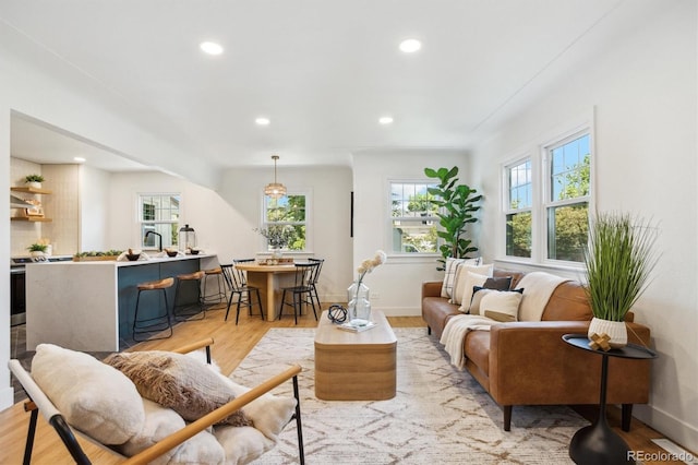 4465 N Umatilla St, Denver, CO 80211 - living area with light wood finished floors and recessed lighting
