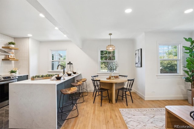 4465 N Umatilla St, Denver, CO 80211 - kitchen featuring stainless steel electric stove, plenty of natural light, light countertops, and recessed lighting