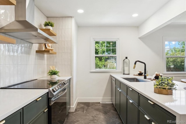 4465 N Umatilla St, Denver, CO 80211 - kitchen with stainless steel range with electric cooktop, wall chimney range hood, open shelves, light countertops, and backsplash