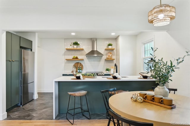 4465 N Umatilla St, Denver, CO 80211 - kitchen featuring wall chimney exhaust hood, freestanding refrigerator, open shelves, decorative backsplash, and light countertops