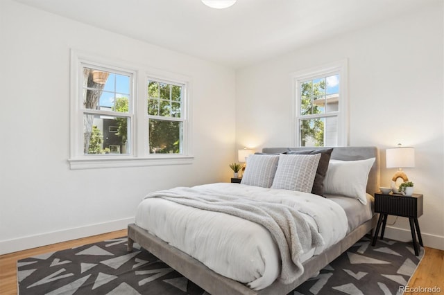 4465 N Umatilla St, Denver, CO 80211 - bedroom with multiple windows and wood finished floors