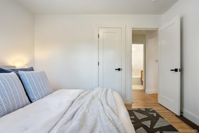4465 N Umatilla St, Denver, CO 80211 - bedroom with light wood finished floors and baseboards