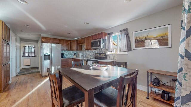 dining room with light hardwood / wood-style flooring