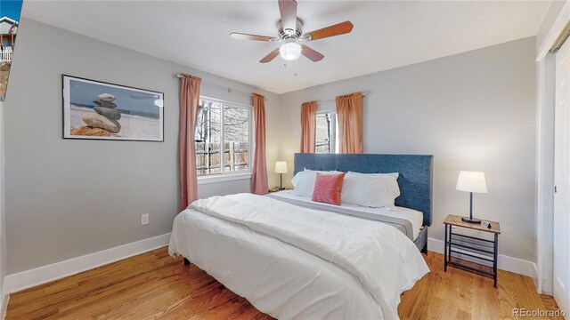 bedroom featuring light hardwood / wood-style floors and ceiling fan