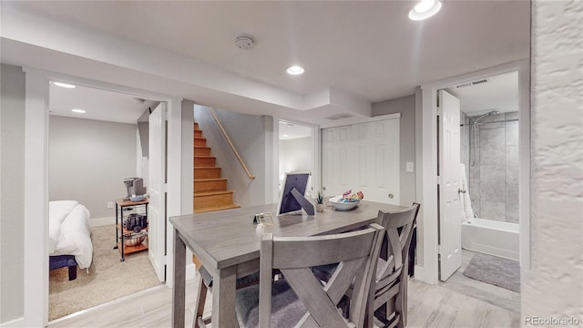 dining space with light hardwood / wood-style flooring