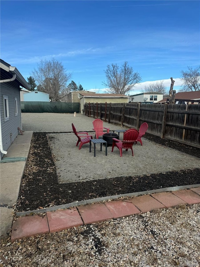 view of yard with a patio and a fire pit