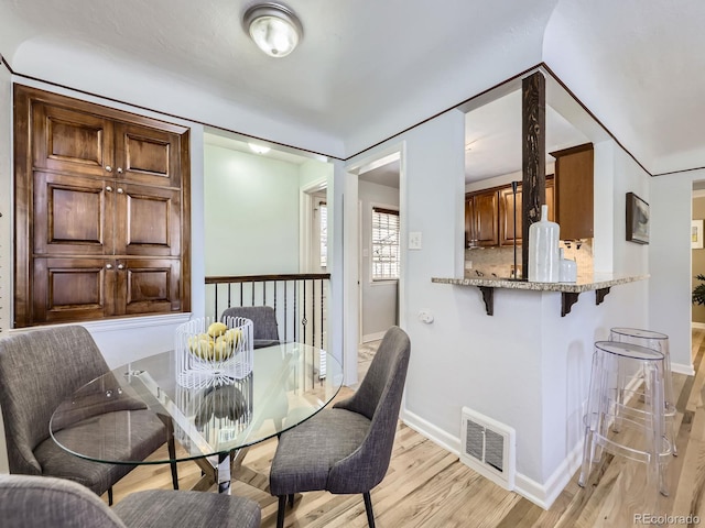 dining space featuring light hardwood / wood-style flooring