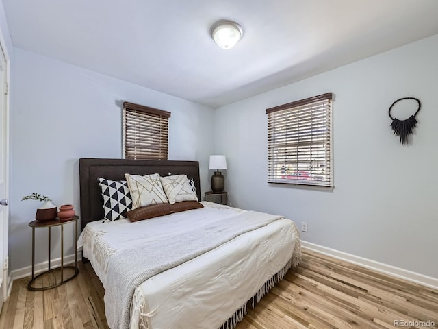 bedroom with hardwood / wood-style floors