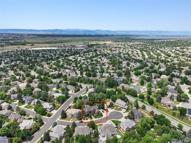 5475 S Laredo St, Centennial, CO 80015 - aerial view of residential area featuring property parcel outlined and mountains