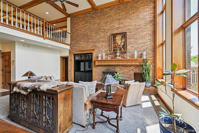 5475 S Laredo St, Centennial, CO 80015 - living room featuring a high ceiling, ceiling fan, a fireplace, and beam ceiling