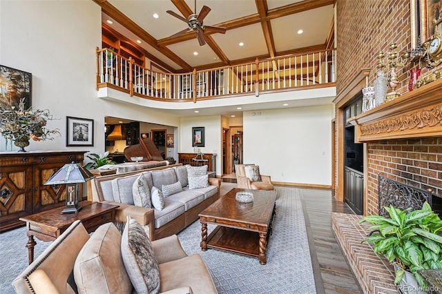 5475 S Laredo St, Centennial, CO 80015 - living room with a high ceiling, a ceiling fan, a fireplace, beamed ceiling, and wood finished floors