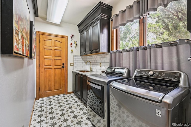 5475 S Laredo St, Centennial, CO 80015 - washroom featuring light flooring, cabinet space, and washer and clothes dryer