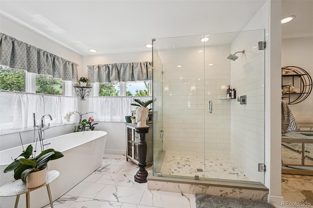5475 S Laredo St, Centennial, CO 80015 - full bathroom with a soaking tub, a stall shower, marble look tile flooring, and recessed lighting