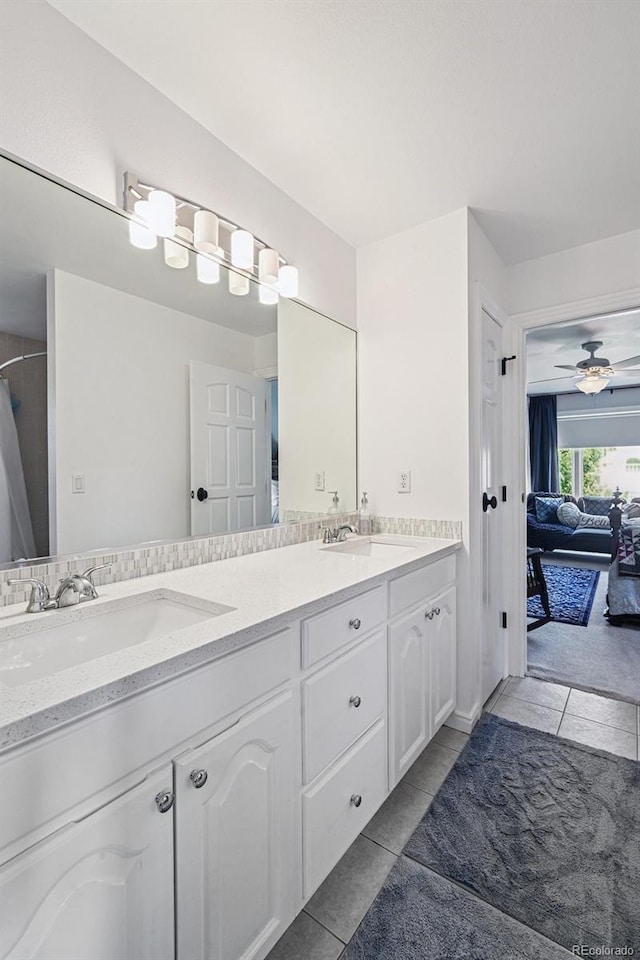 5475 S Laredo St, Centennial, CO 80015 - full bath featuring tile patterned flooring, double vanity, a ceiling fan, and ensuite bath