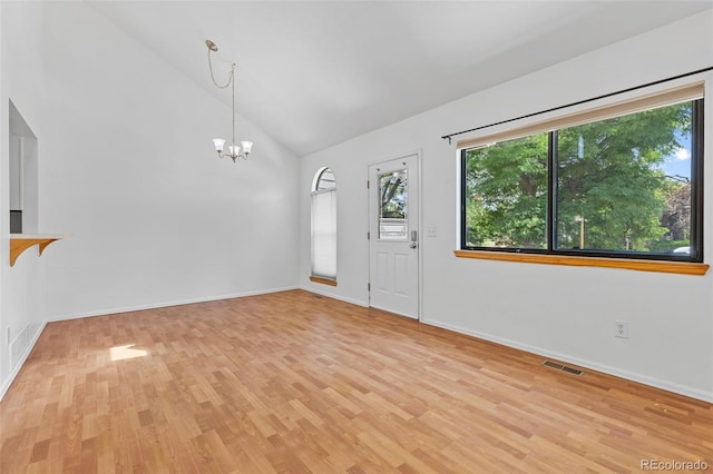323 S Taft Ct Unit 26, Louisville, CO 80027 - unfurnished living room featuring light wood finished floors, a chandelier, and high vaulted ceiling