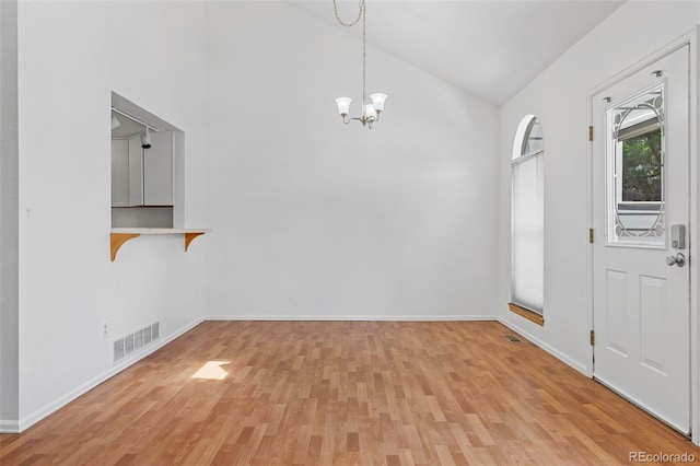 323 S Taft Ct Unit 26, Louisville, CO 80027 - entryway featuring light wood-type flooring, a chandelier, and high vaulted ceiling