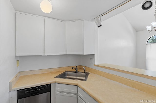 323 S Taft Ct Unit 26, Louisville, CO 80027 - kitchen with stainless steel dishwasher, light countertops, white cabinetry, and a chandelier
