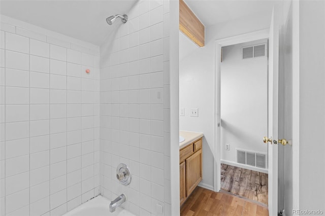 323 S Taft Ct Unit 26, Louisville, CO 80027 - bathroom with vanity, wood finished floors, and tub / shower combination