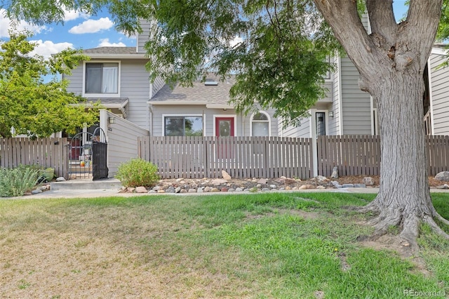 323 S Taft Ct Unit 26, Louisville, CO 80027 - view of front of home featuring roof with shingles and a chimney