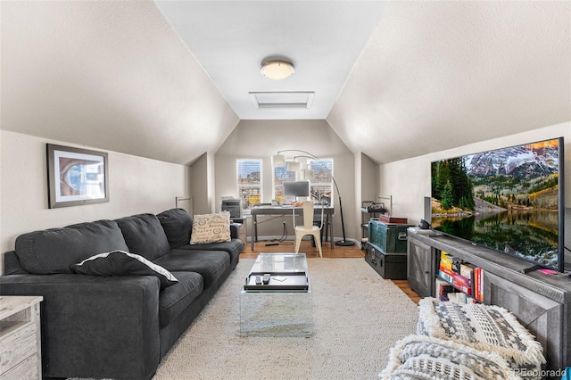 living room with lofted ceiling and light wood-type flooring