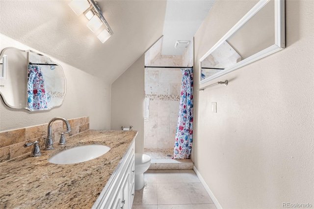 bathroom featuring lofted ceiling, vanity, walk in shower, toilet, and tile patterned floors