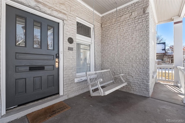 entrance to property featuring covered porch