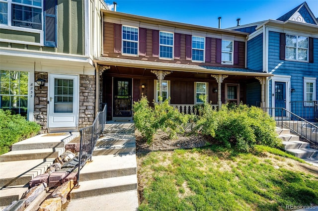 8231 S Fillmore Way, Centennial, CO 80122 - view of property featuring a porch and stone siding