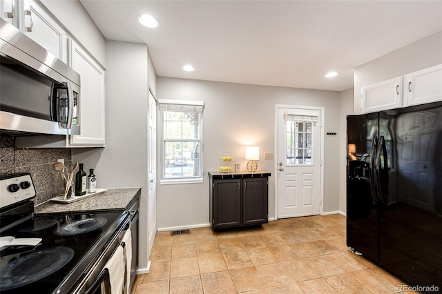 8231 S Fillmore Way, Centennial, CO 80122 - kitchen with stainless steel appliances, baseboards, white cabinetry, and recessed lighting