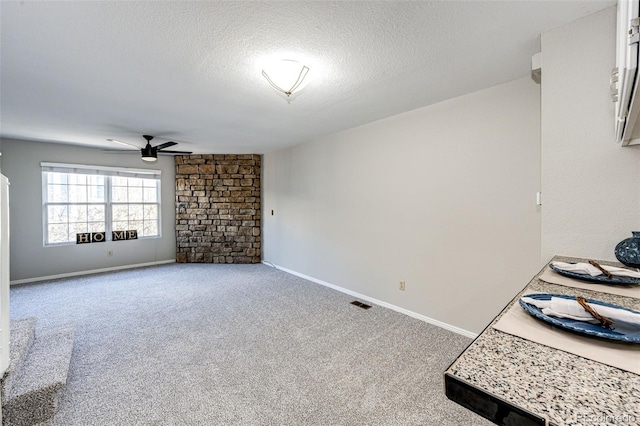 8231 S Fillmore Way, Centennial, CO 80122 - spare room with a ceiling fan, carpet flooring, a textured ceiling, and baseboards