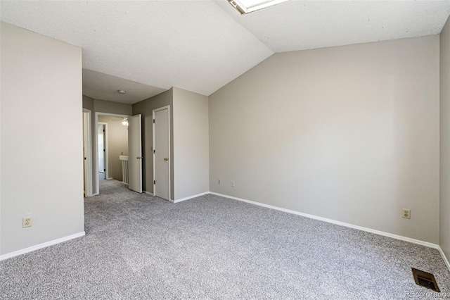 8231 S Fillmore Way, Centennial, CO 80122 - spare room with carpet, baseboards, and lofted ceiling