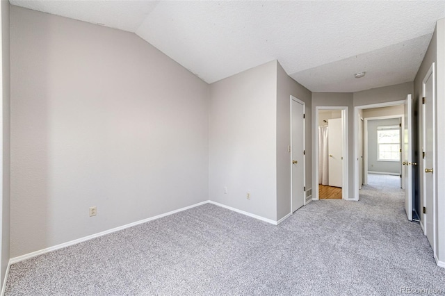 8231 S Fillmore Way, Centennial, CO 80122 - unfurnished room with carpet floors, baseboards, and vaulted ceiling