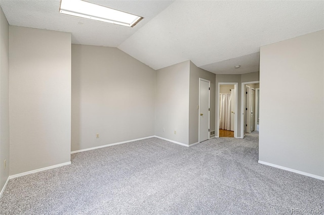 8231 S Fillmore Way, Centennial, CO 80122 - carpeted empty room featuring vaulted ceiling and baseboards
