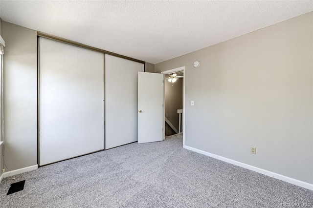 8231 S Fillmore Way, Centennial, CO 80122 - unfurnished bedroom with carpet floors, a closet, baseboards, and a textured ceiling