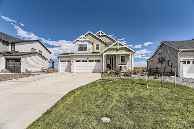 craftsman house featuring a porch, an attached garage, concrete driveway, board and batten siding, and a front yard