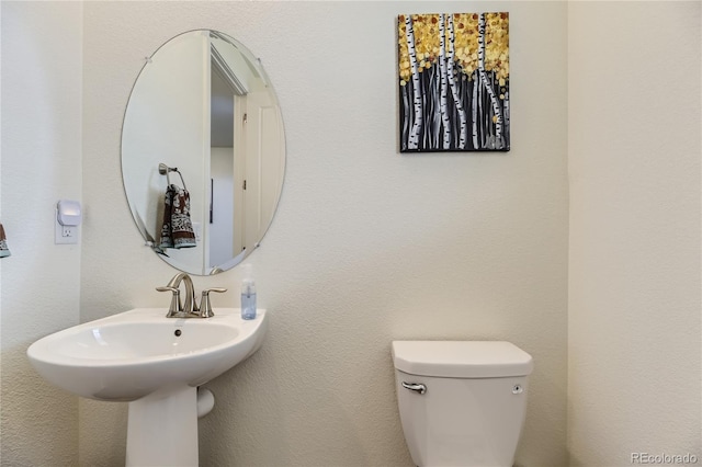 bathroom featuring toilet