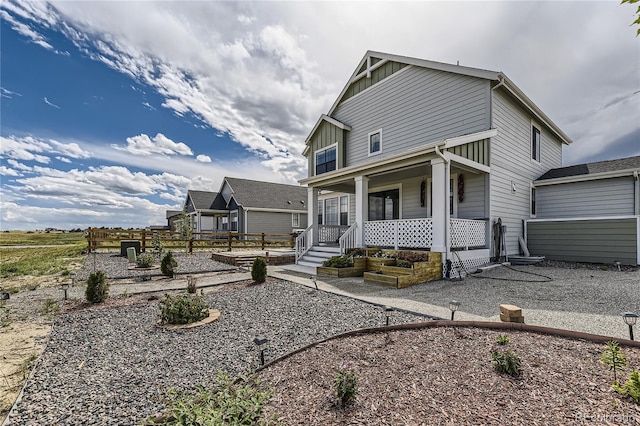 view of front facade featuring covered porch and board and batten siding