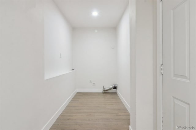washroom with light wood-type flooring, baseboards, and recessed lighting