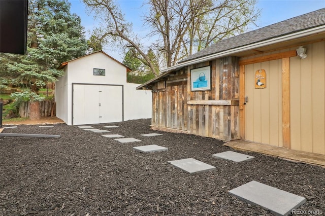 view of yard featuring an outbuilding and a storage unit