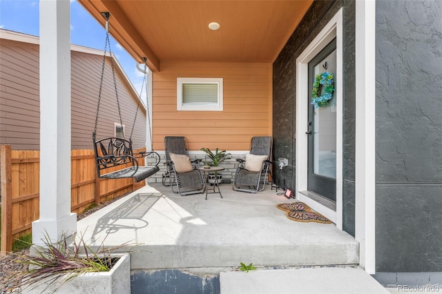 view of patio / terrace featuring fence