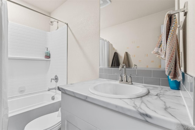 full bathroom featuring washtub / shower combination, toilet, and vanity