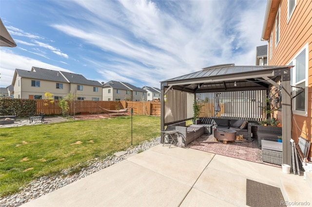 view of patio with a gazebo, a residential view, outdoor lounge area, and fence