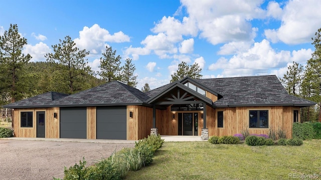 3763 County Road 43, Bailey, CO 80421 - view of front facade with a front yard, an attached garage, and driveway