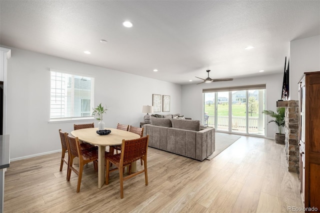 7202 S Valleyhead Ct, Aurora, CO 80016 - dining space featuring light wood finished floors, ceiling fan, recessed lighting, and baseboards