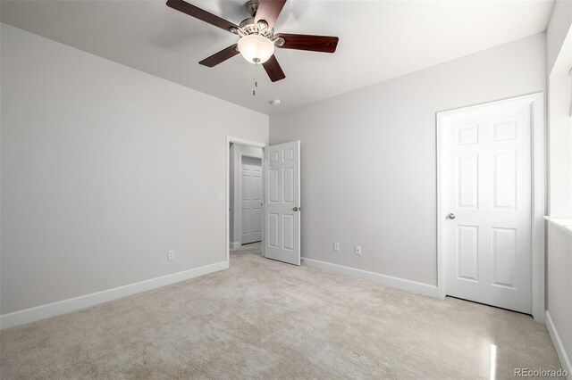 7202 S Valleyhead Ct, Aurora, CO 80016 - unfurnished bedroom with light colored carpet, baseboards, and ceiling fan